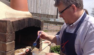 Humble-by-Nature-Cooking-on-a-wood-fired-oven
