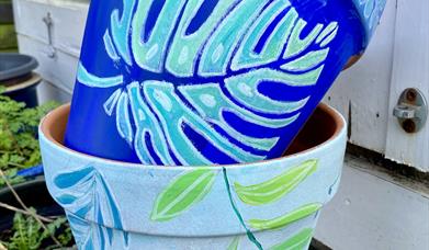 Plant pots painted by Sian
