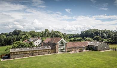 Lodge Barn - aerial view of the generous outdoor space, quiet rural location and spacious accommodation at Lodge Barn 