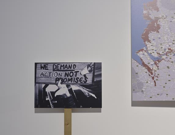 Placards against a white wall