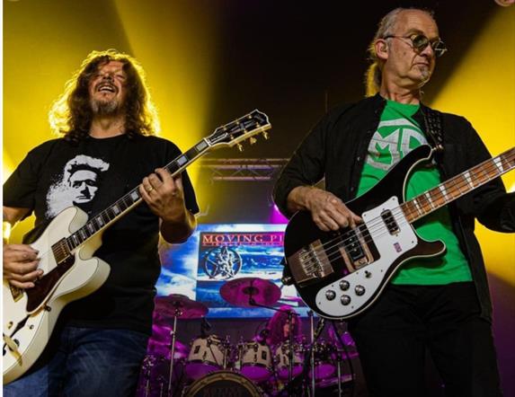 Moving pictures frontmen playing guitars on stage