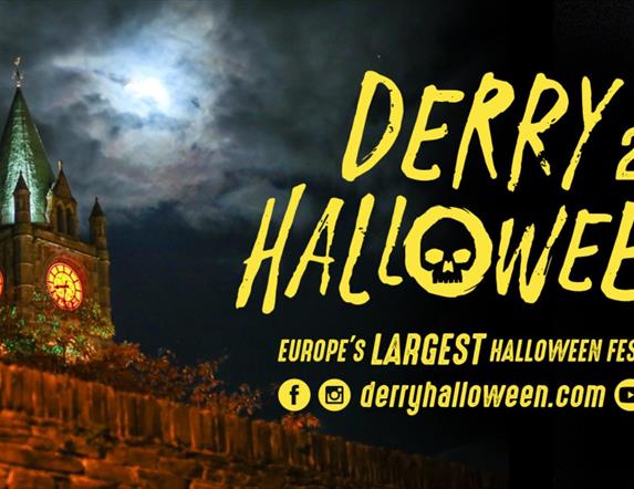 Derry Halloween banner with the Guildhall in the background.