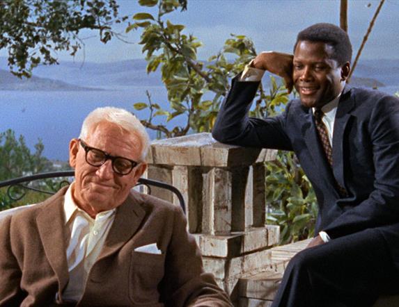 Two men outside smiling