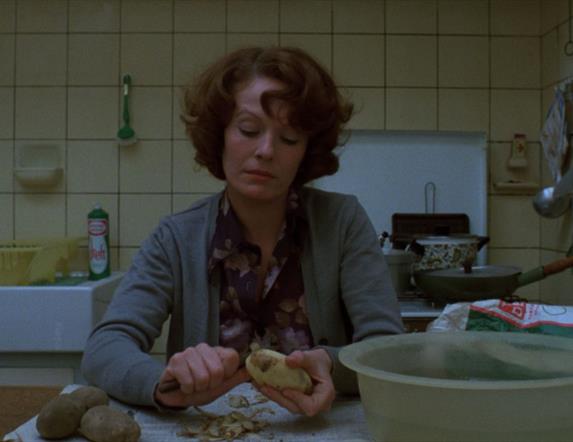 Woman sitting in kitchen