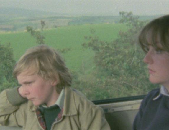 Young boy and girl sitting in a car