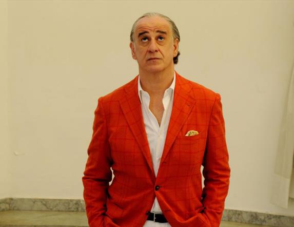Man looking upwards in an art gallery