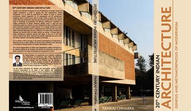 Building, brown in colour, in 1970s style, with writing overlaid