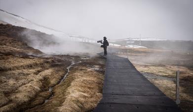 Person stands in the wilderness