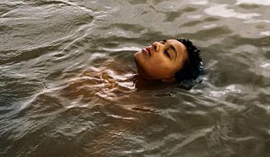 young girl floating in water