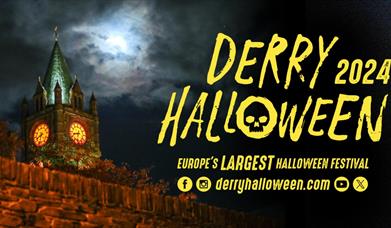 Derry Halloween banner with the Guildhall in the background.