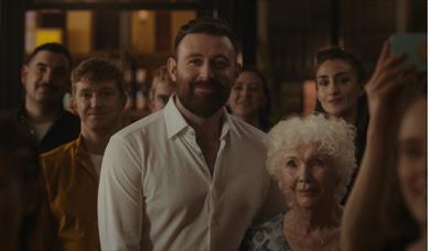 Four mothers and a son sitting round a table