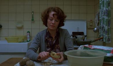 Woman sitting in kitchen