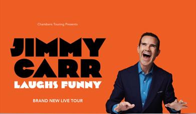 Promotional image of Jimmy Carr laughing.