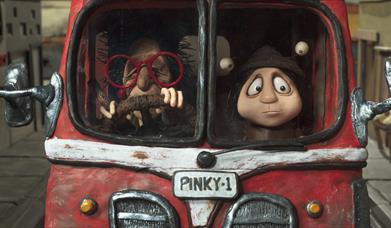 animated snail and human in a car