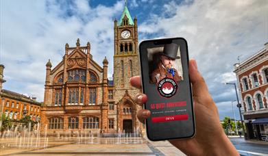The Go Quest Adventures app on a phone with the Guildhall in the background.