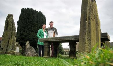 Visitors at Patrick Street Graveyard in Strabane. 
