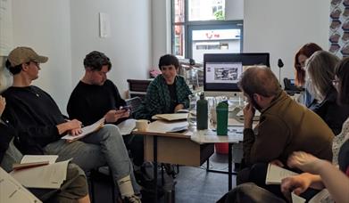 People sitting around a table having a discussion