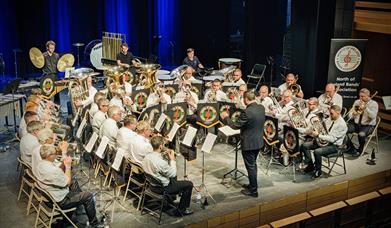 The Strabane Brass Band gathered at a performance.