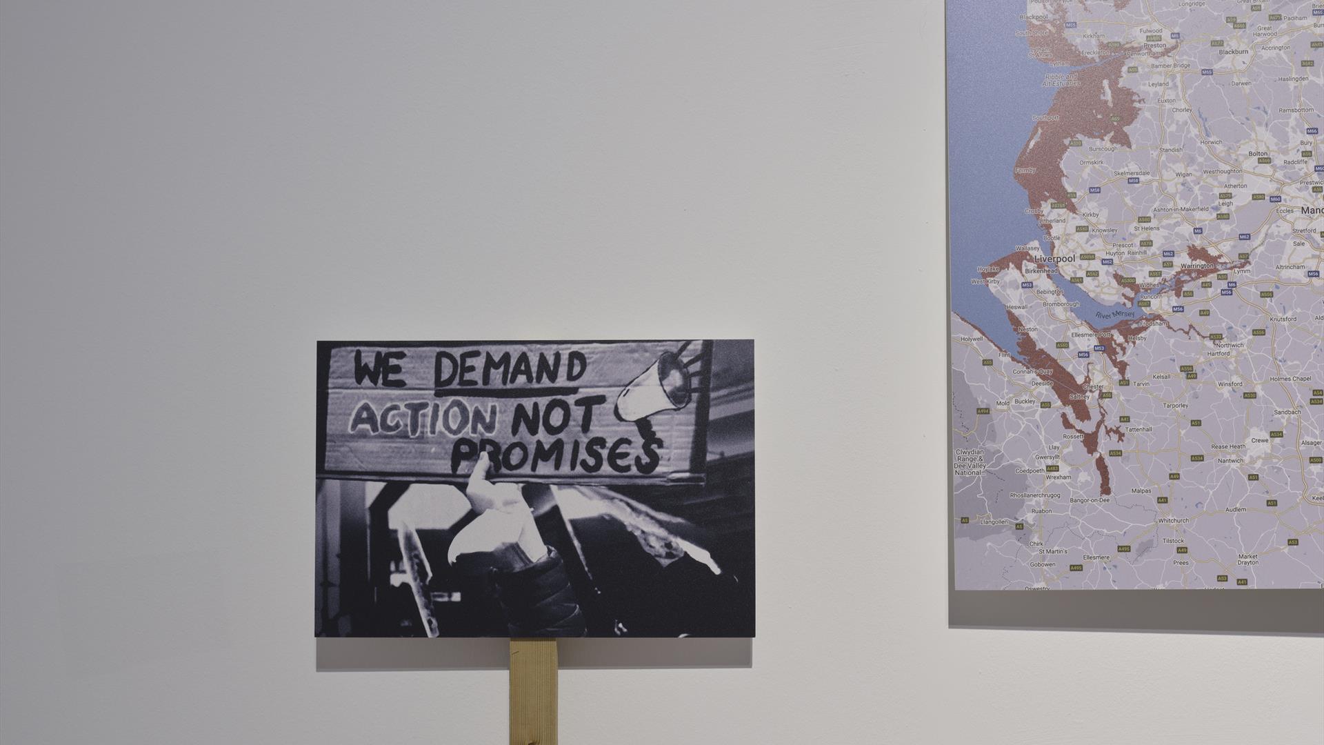 Placards against a white wall