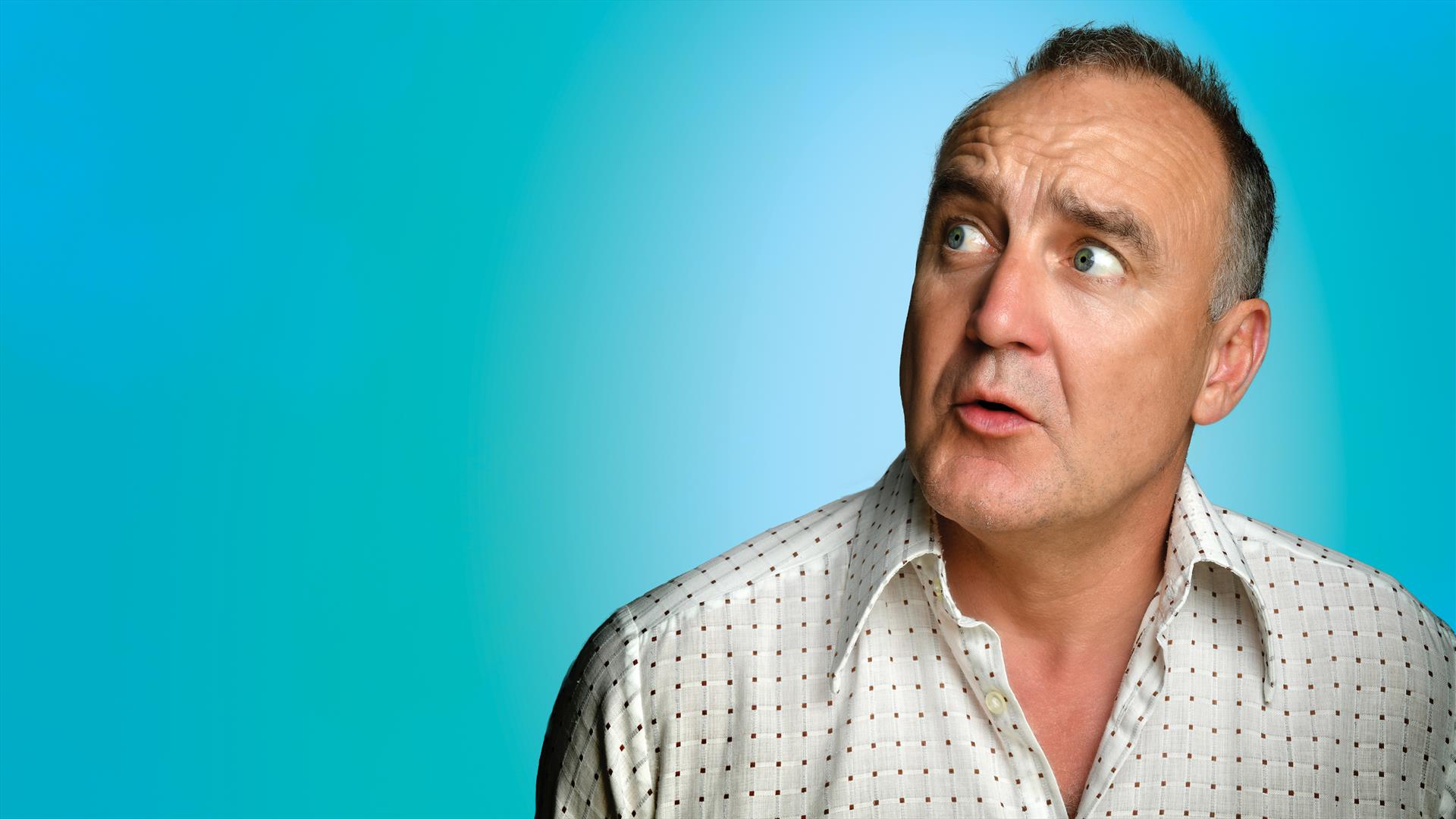 Jimeoin looking to his left side, confused, against a  bold, light blue background.