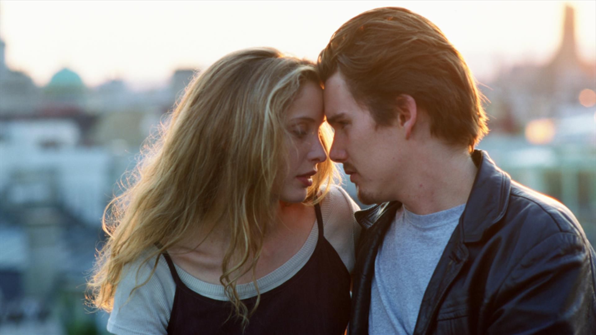 man and woman closely looking at one another