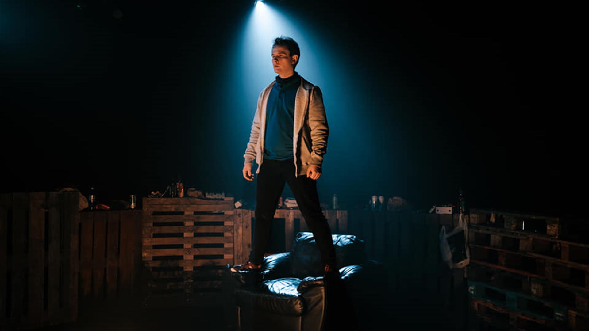 Man stands on top of pallets