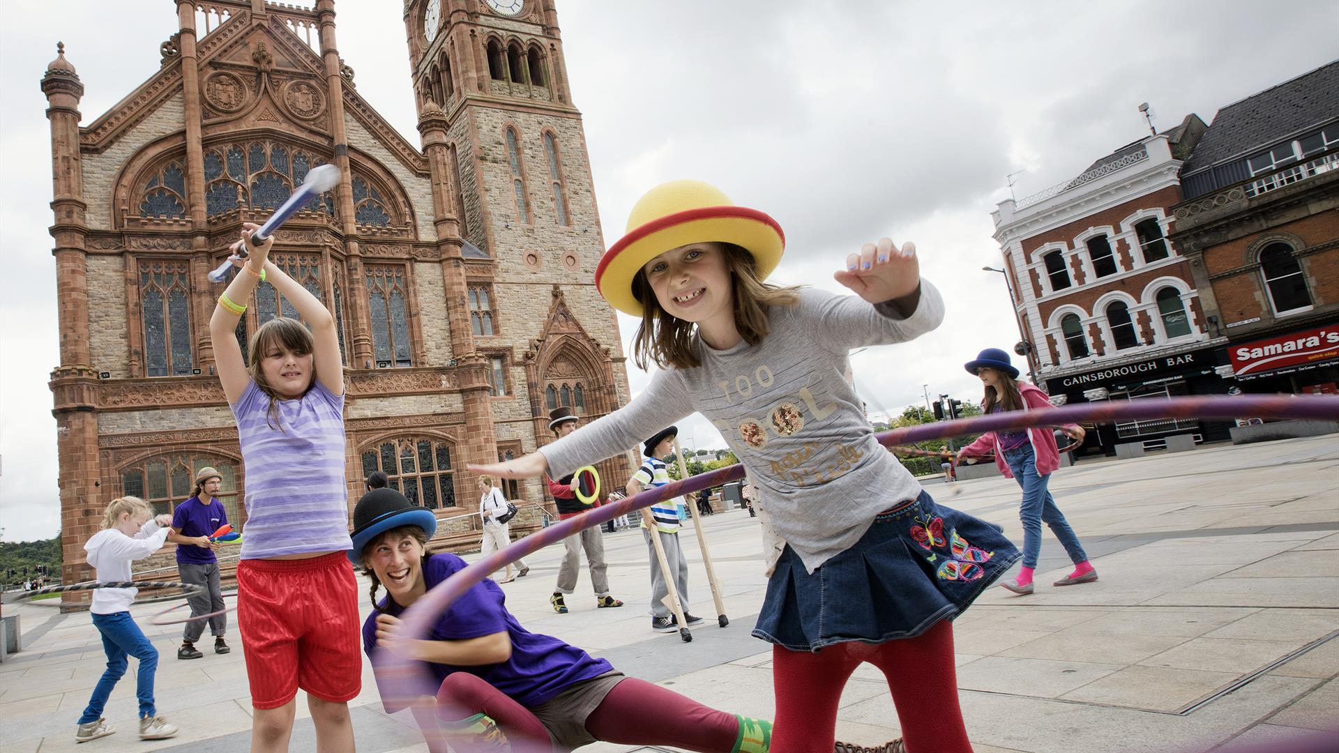 Children enjoying circus skills outside