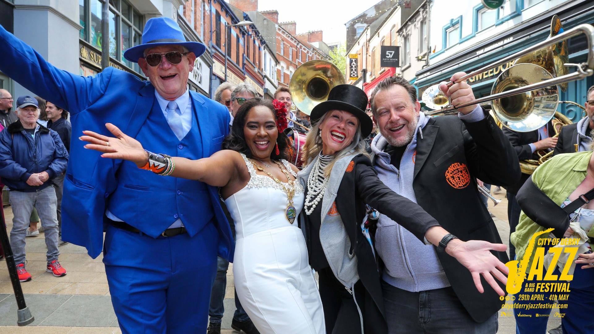 Band members, local people and the Mayor enjoying the DLD Second Line Parade at the 2025 Jazz Festival