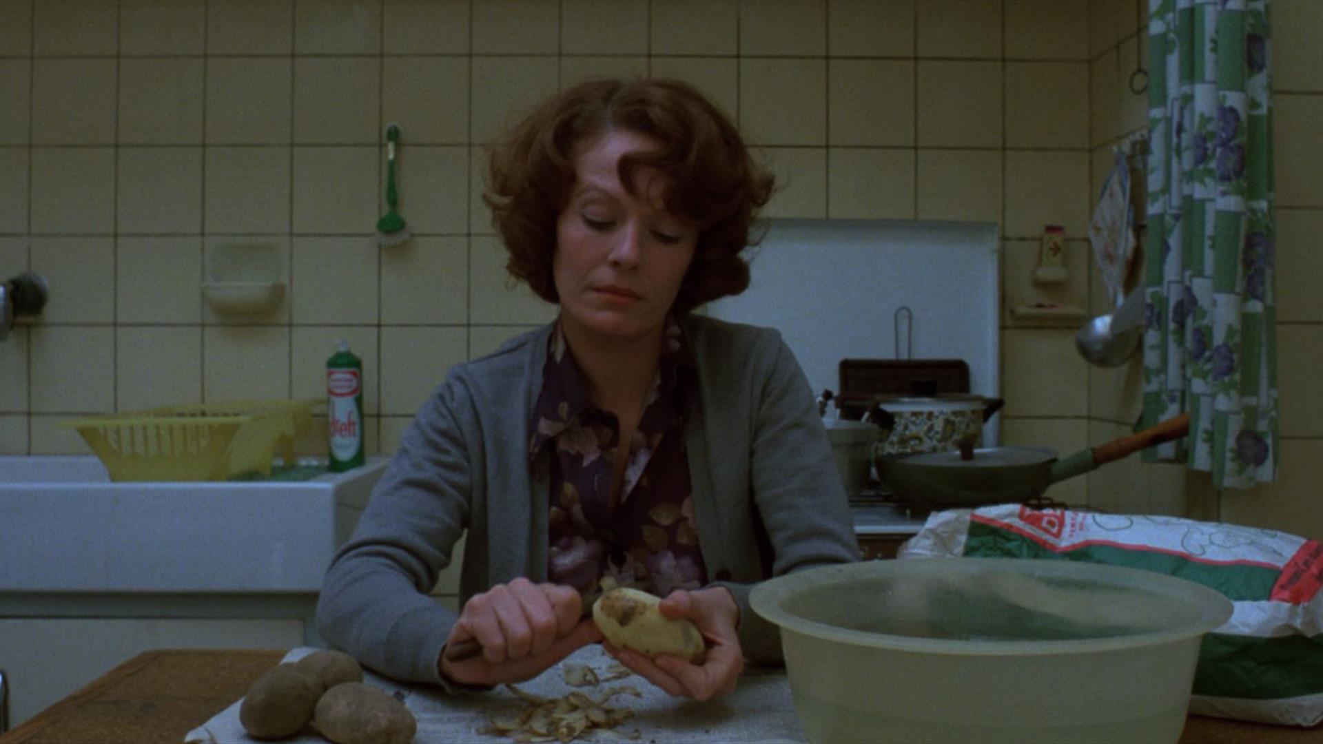 Woman sitting in kitchen