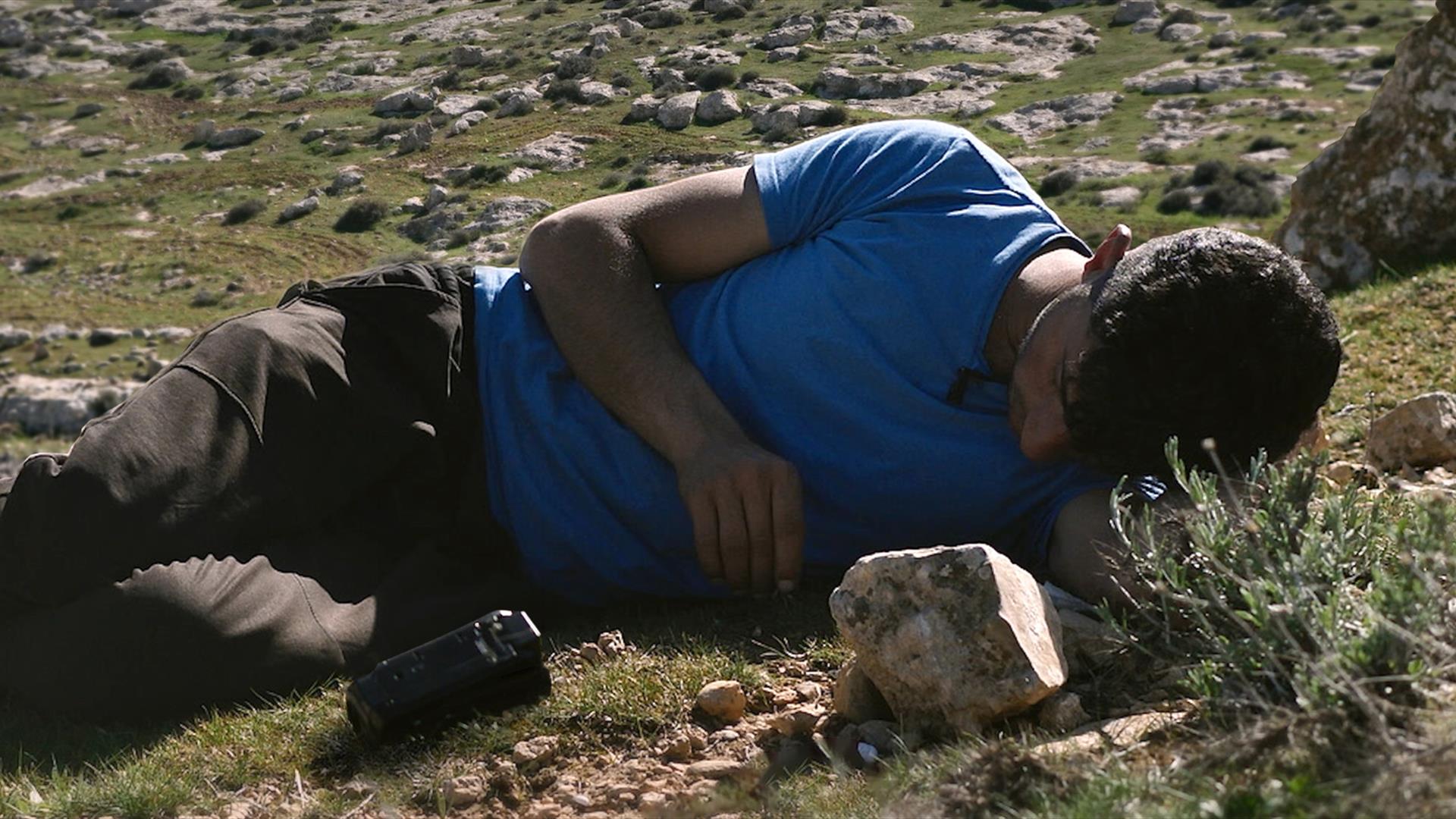 Man lying down in a field