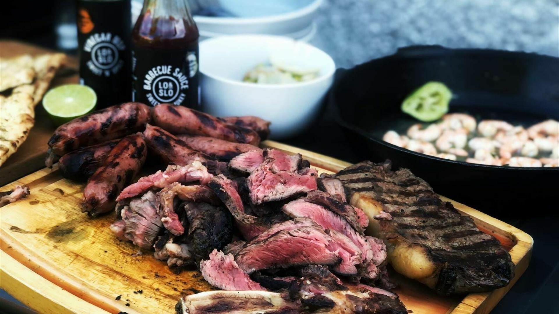 Barbecued meat on a chopping board