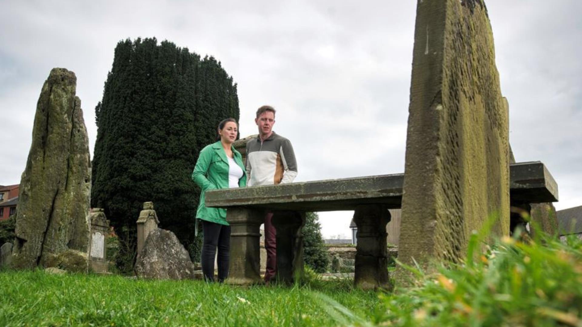 Visitors at Patrick Street Graveyard in Strabane. 
