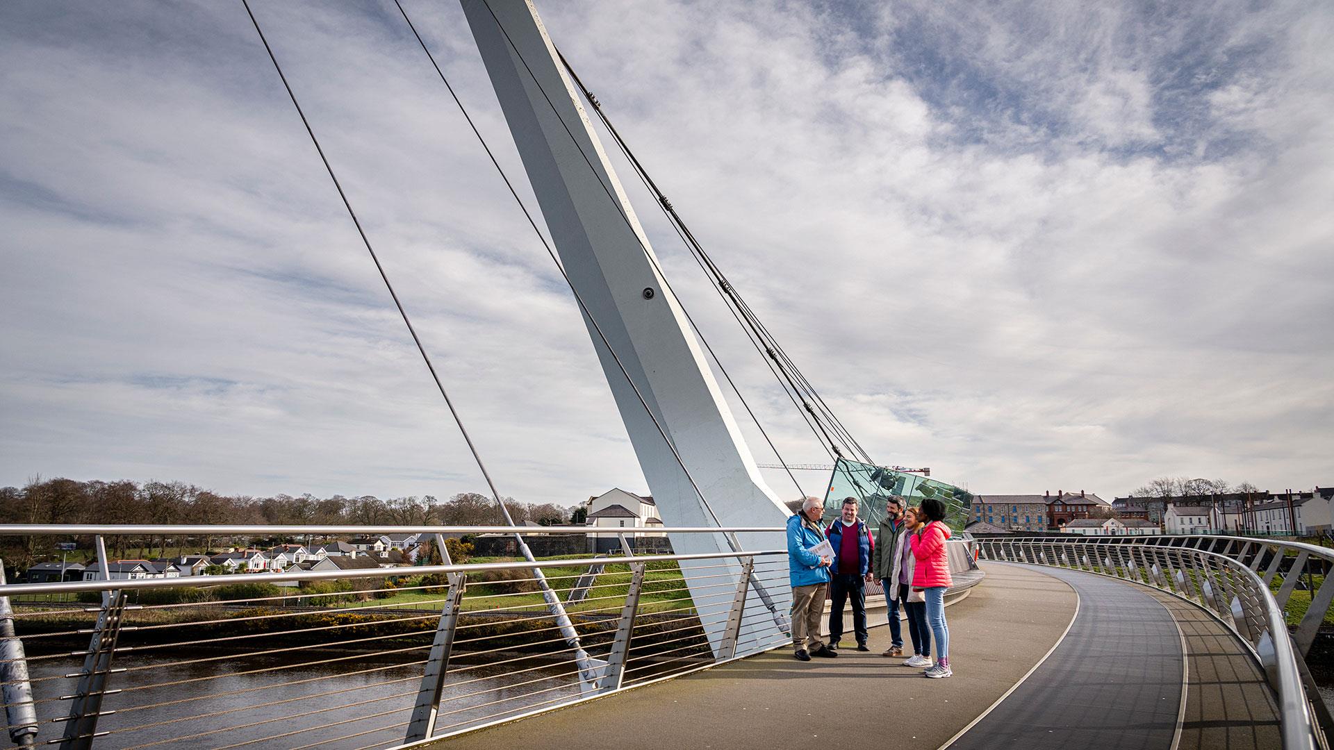 Group on the Peace Bridge in Derry~Londonderry with guide David from Derrie Danders