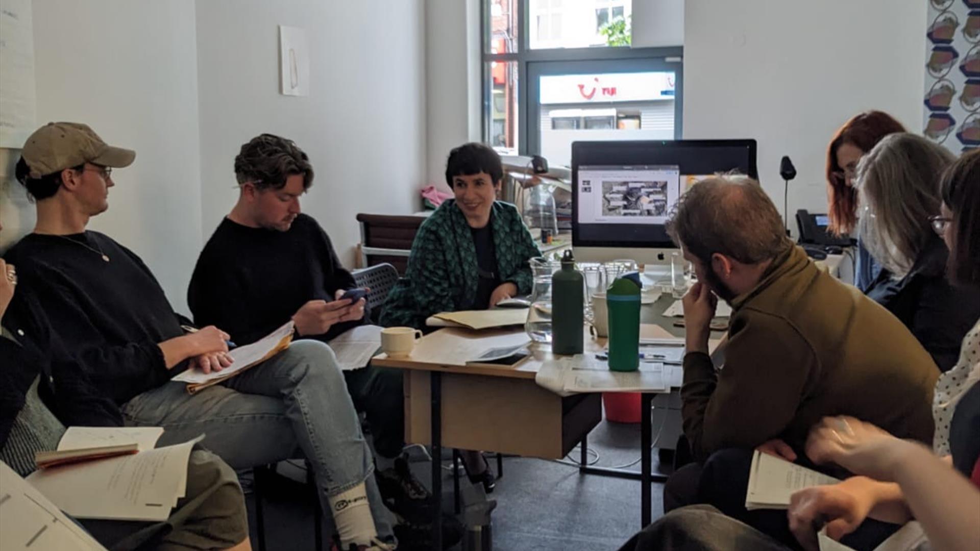 People sitting around a table having a discussion