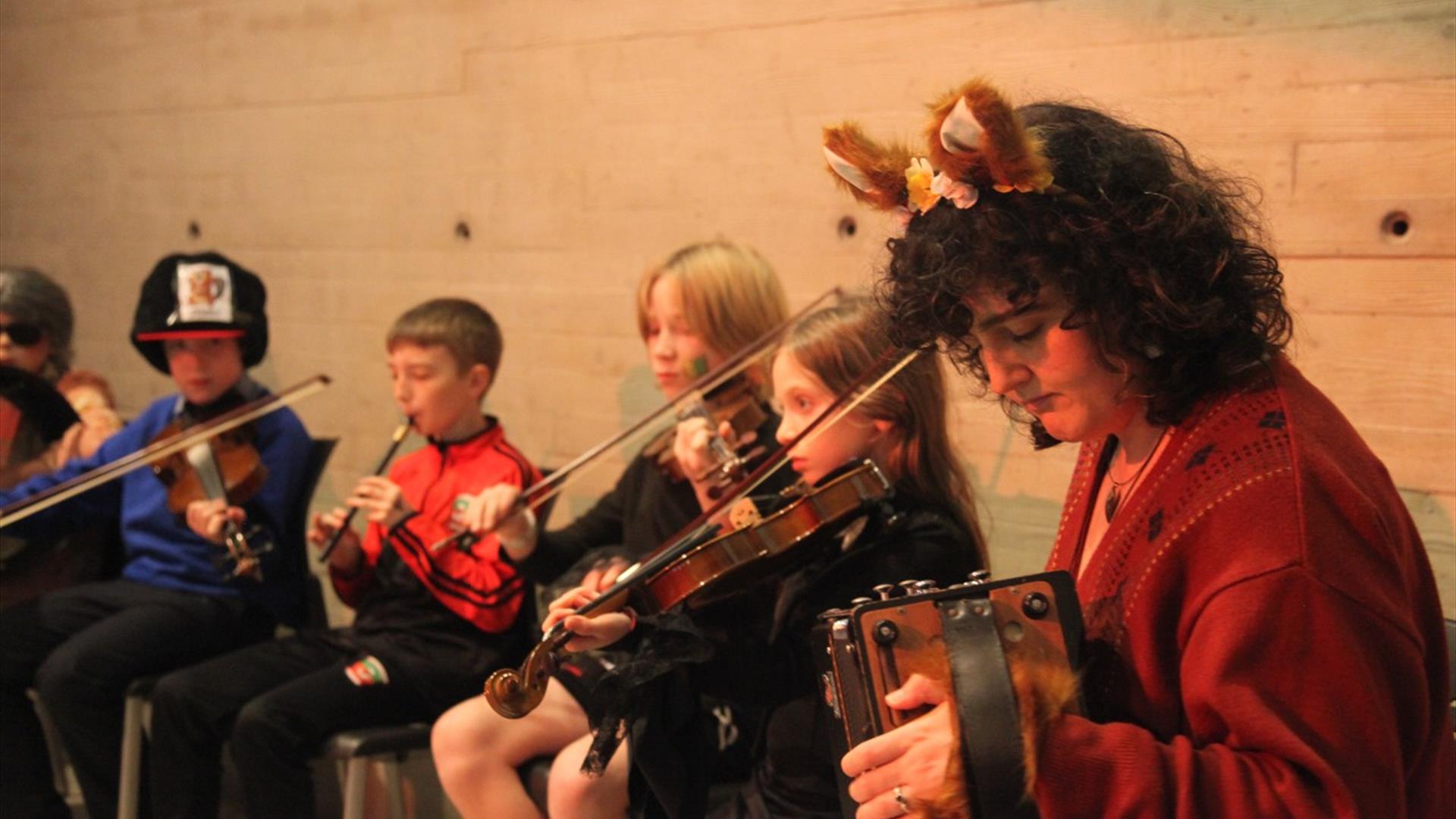 Acadamh students playing instruments.