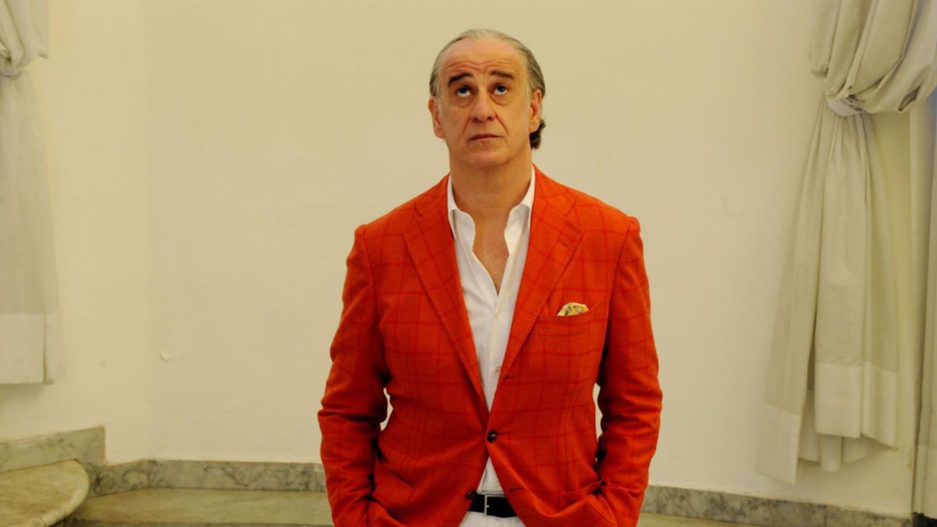 Man looking upwards in an art gallery