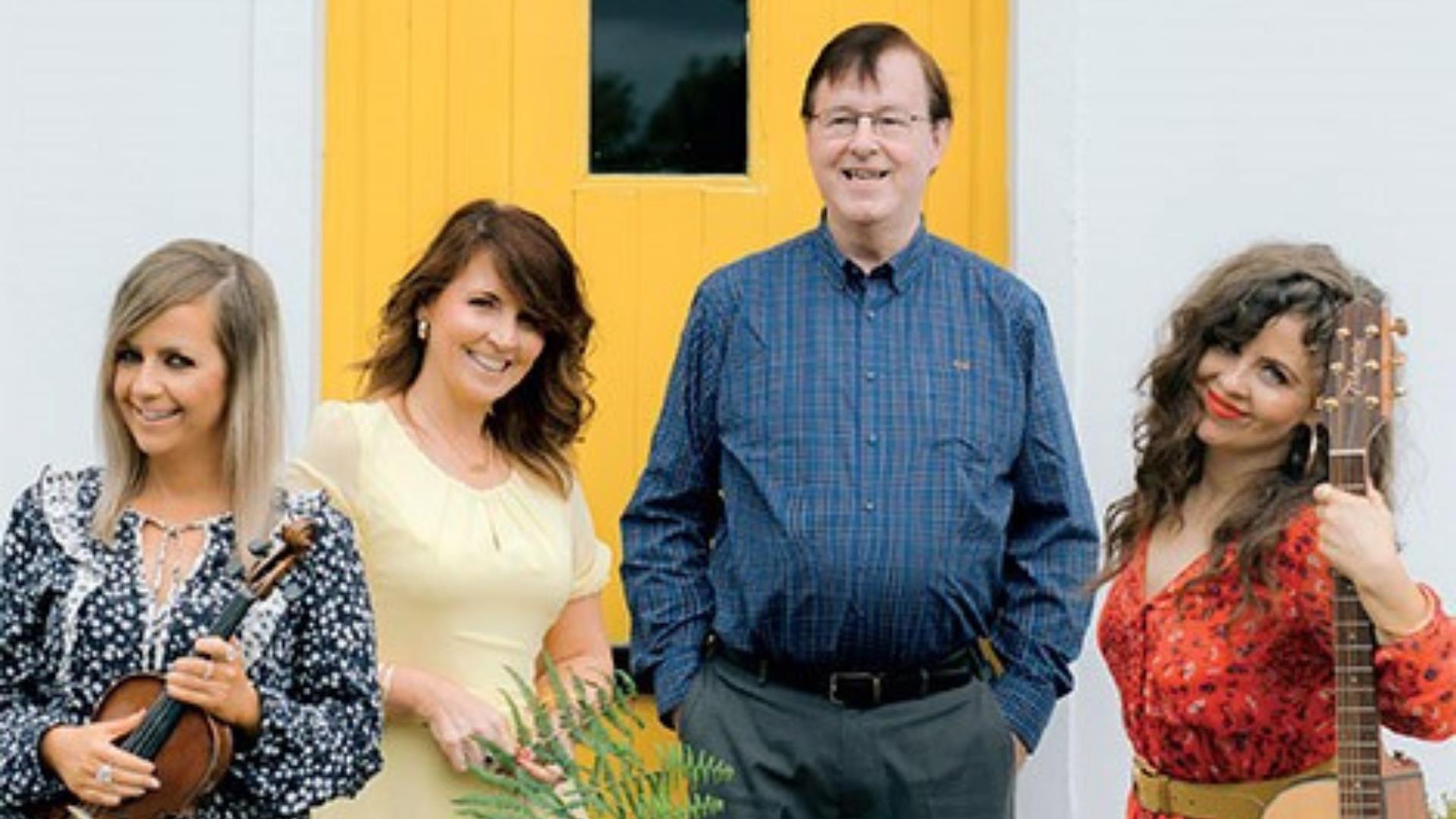 Photo of the Murphy family in front of a yellow door