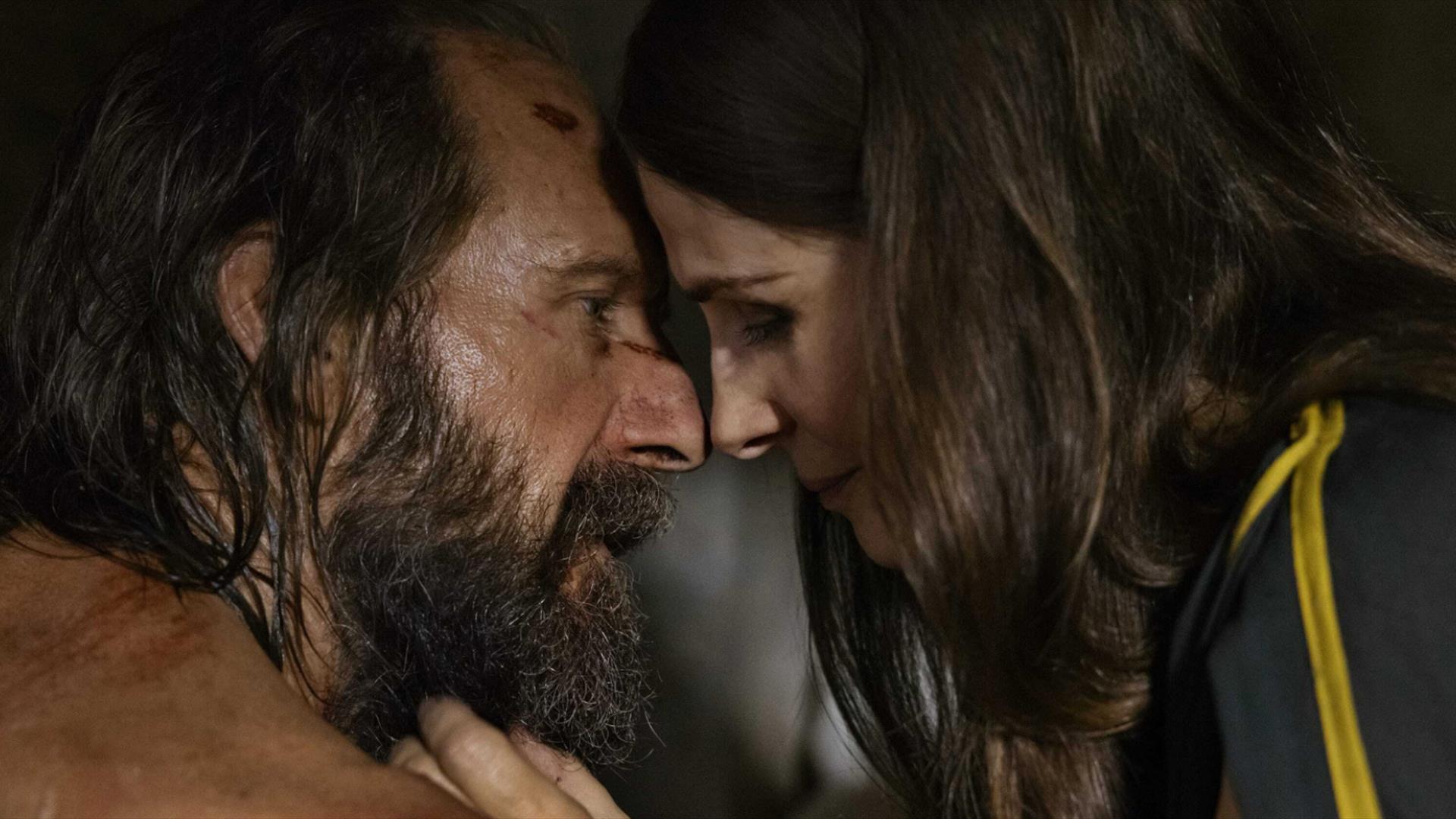 man and woman closely looking at one another