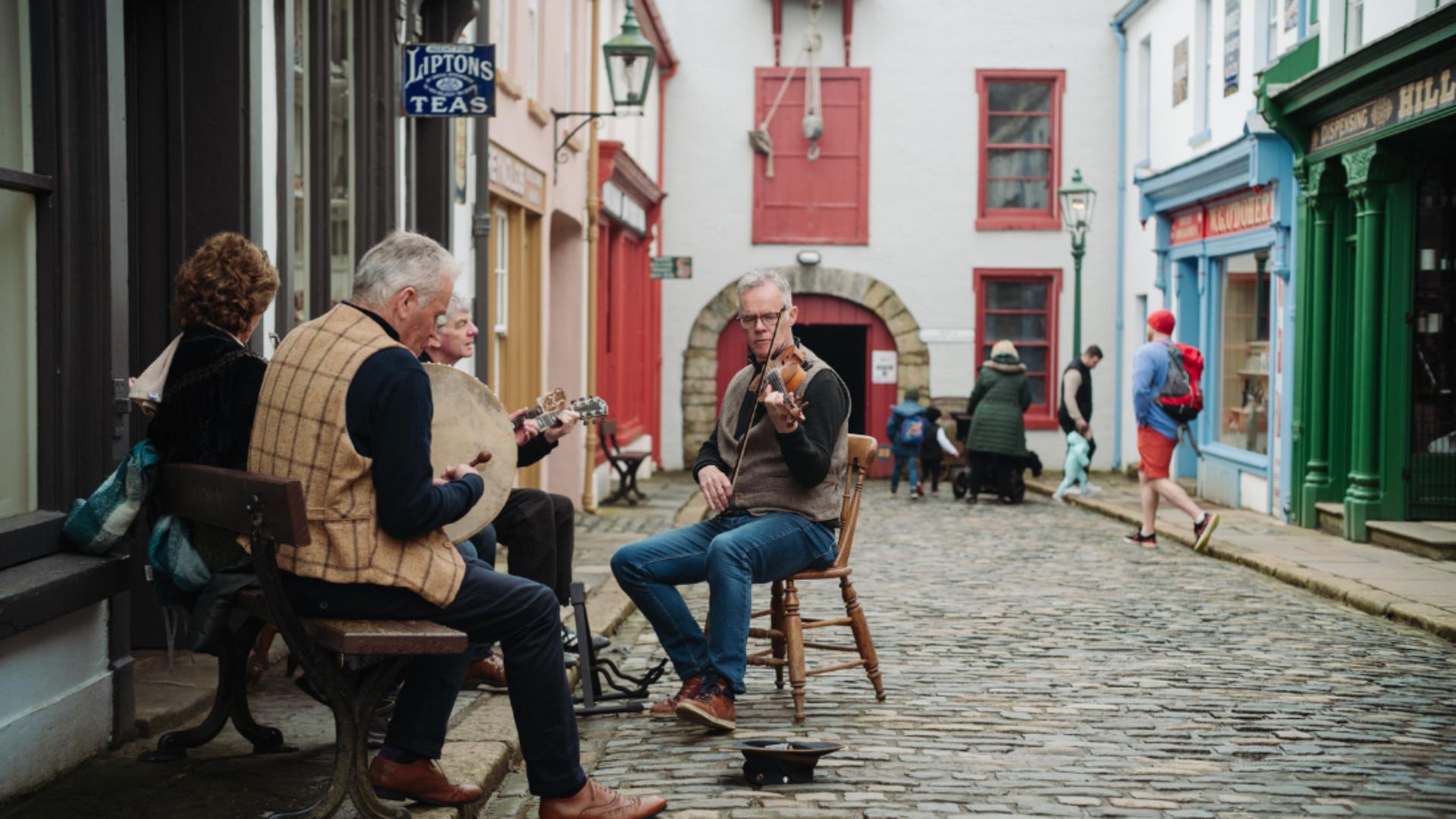A group of musicians playing at the Folk Park