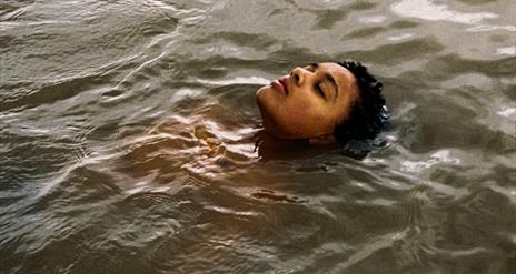 young girl floating in water
