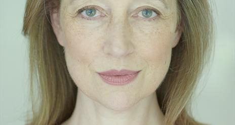 Image is head and shoulders photo of Elizabeth, the author
