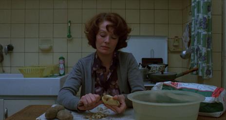 Woman sitting in kitchen