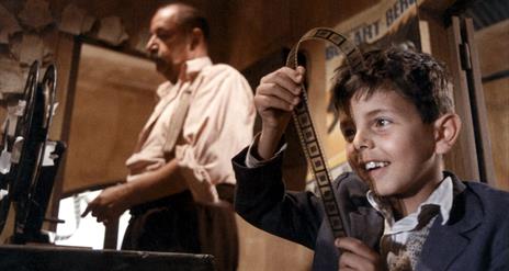 man and young boy in cinema projection room