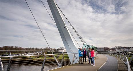 Group on the Peace Bridge in Derry~Londonderry with guide David from Derrie Danders