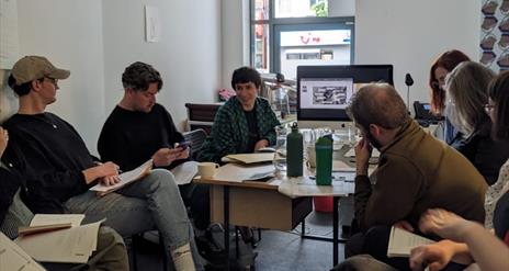 People sitting around a table having a discussion