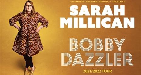 Sarah Millican standing with her hands on her hips in a loudly patterned dress, beside her in large text- 'SARAH MILLICAN- BOBBY DAZZLER' against a wa