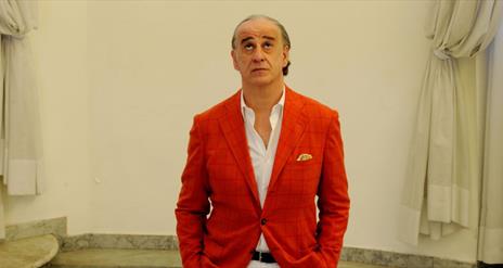 Man looking upwards in an art gallery