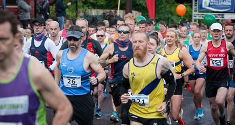 Group of people running in a marathon