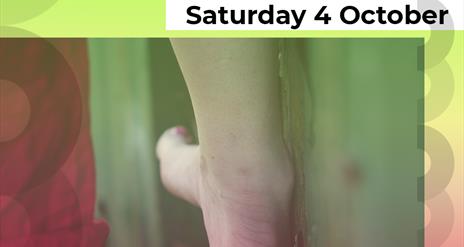 A photograph of a woman's right foot balancing on a slim piece of wood. The foot is facing away and the big toe is painted pink. Above the photograph