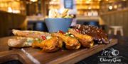 sharing board of chicken wings, ribs, cheesy bread and chips